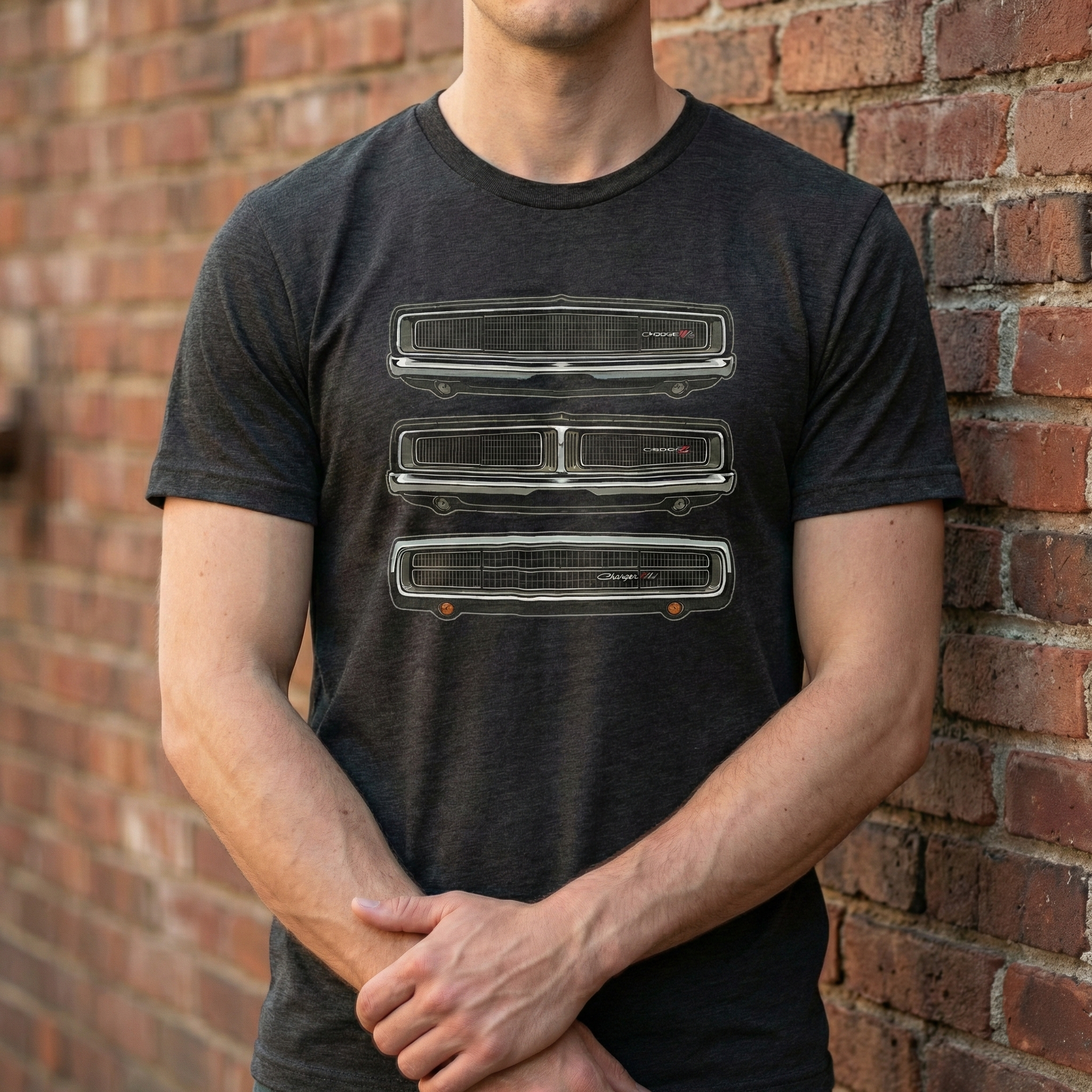 Person wearing a black t-shirt with graphic design against a brick wall