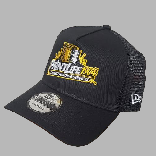 Black cap with yellow and white text and graphics on a gray background
